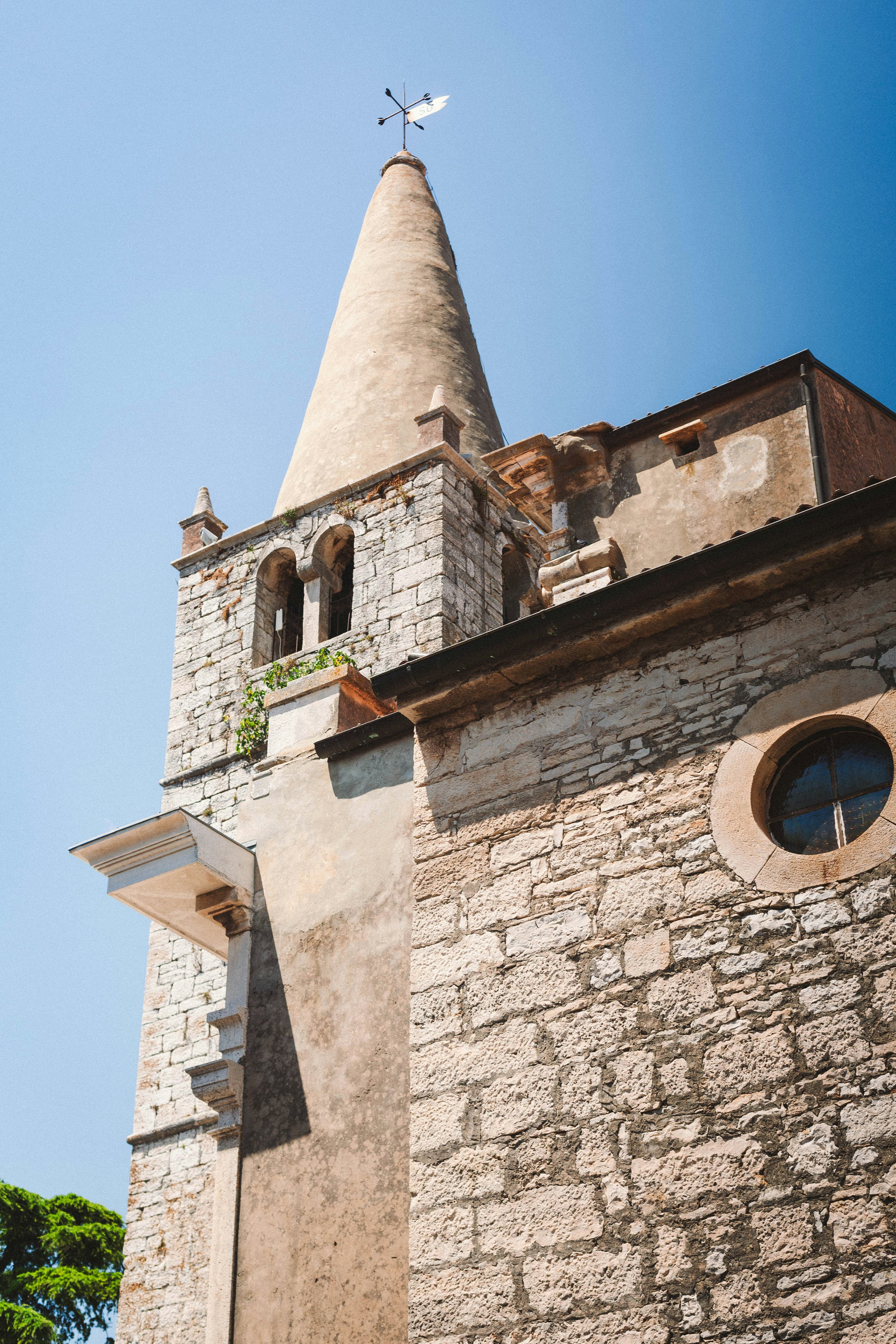 Exterior stone façade of the Romanesque Church of the Holy Spirit in Bale, western Istria