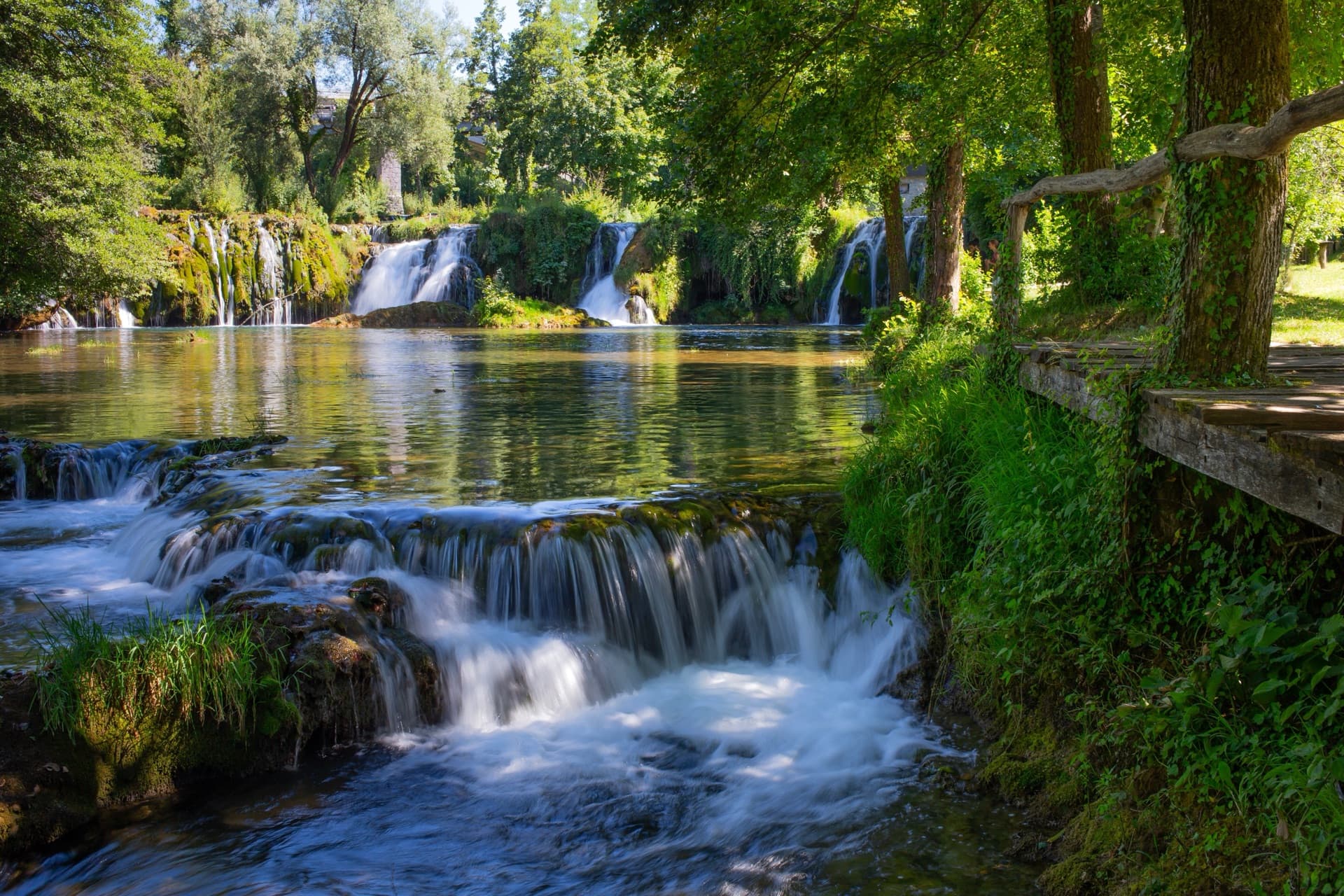 Crystal-clear Mrežnica river with waterfalls and natural swimming spots