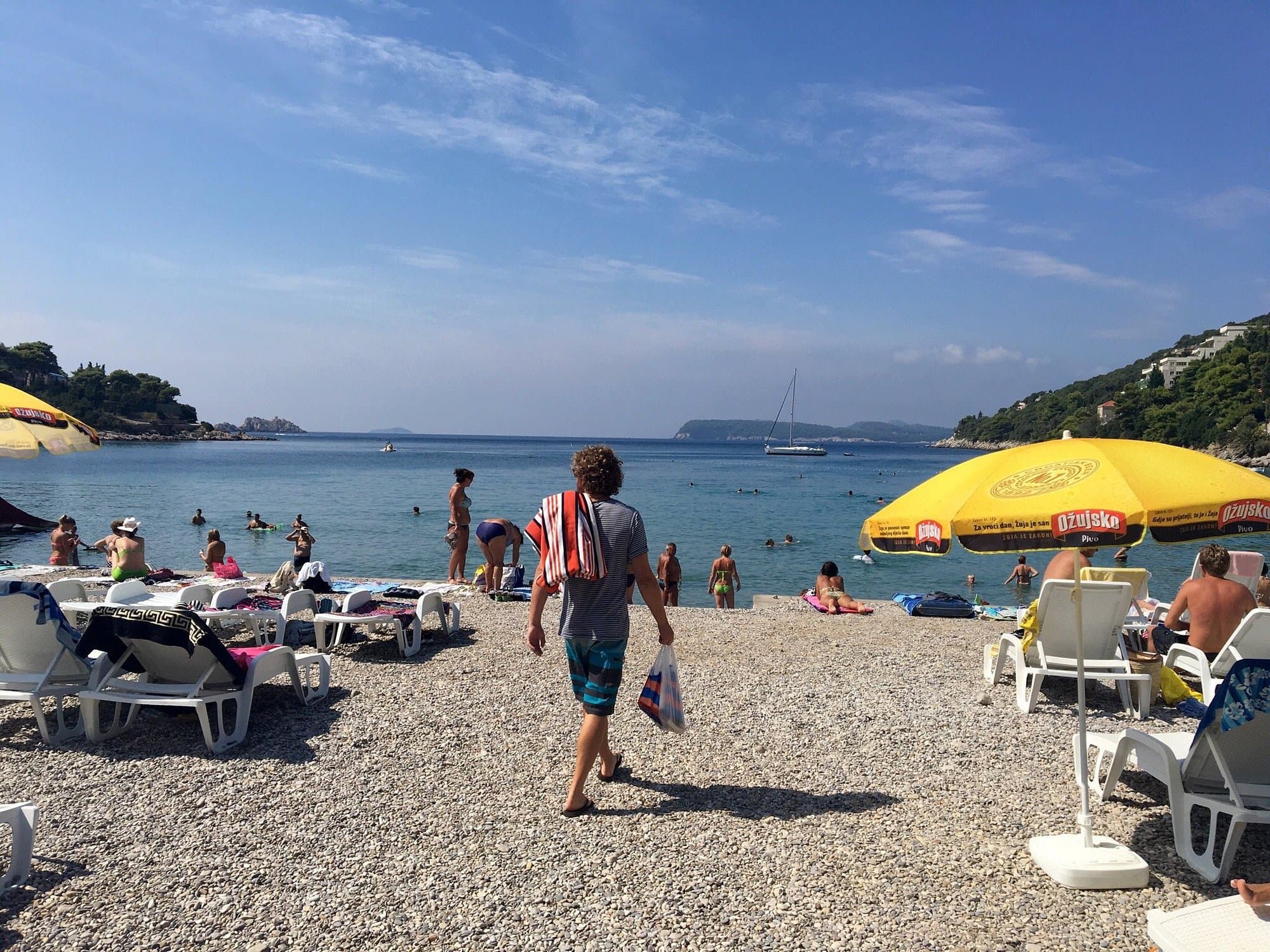 Lapad Beach in Dubrovnik with palm-lined promenade and calm bay