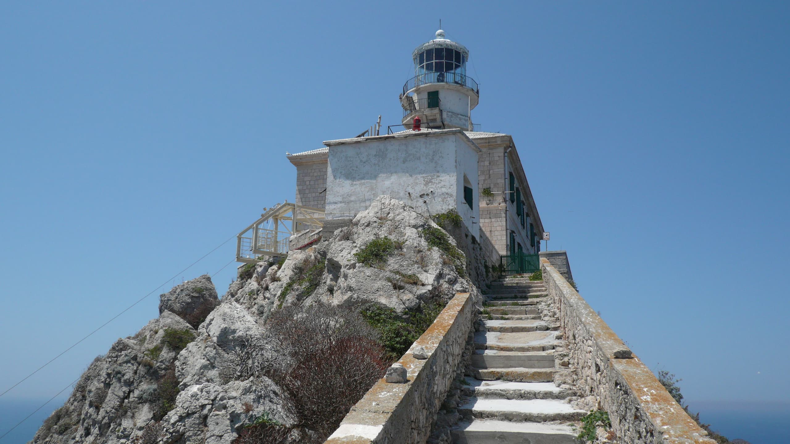 Palagruža lighthouse perched on a steep ridge on Croatia's most remote inhabited island.