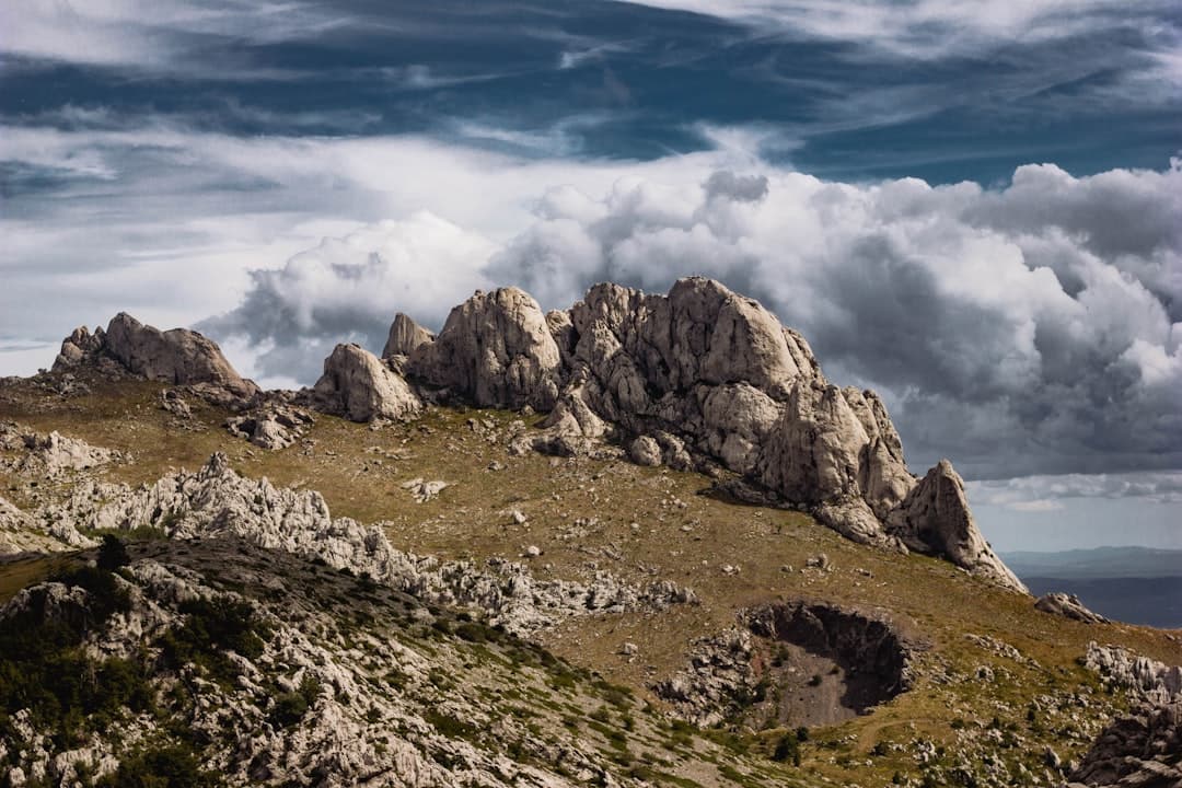 Jagged limestone peaks of the southern Velebit massif under banked cloud — the high country above Paklenica's canyons.