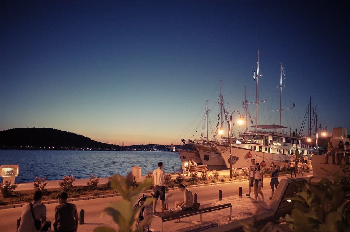 Rogoznica at night with harbor lights reflecting on the water