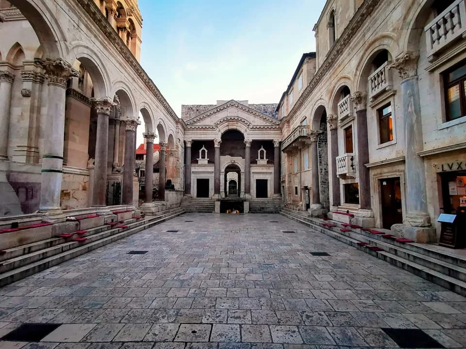 The central courtyard of Diocletian's Palace, surrounded by colonnades and ancient temples, and a must-see when exploring Split attractions.