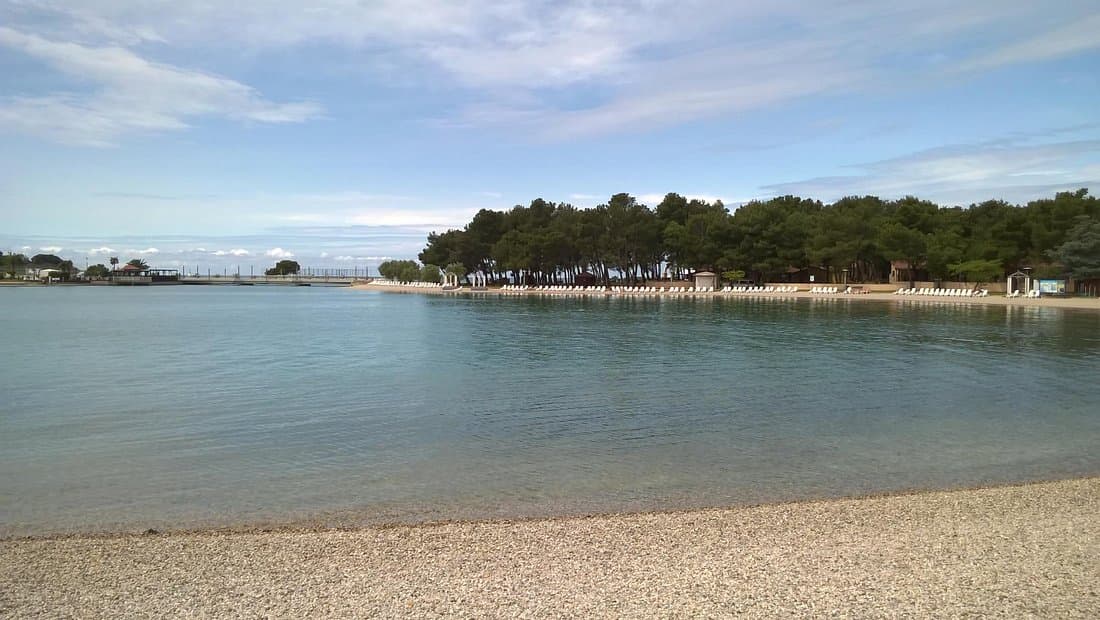 Umag beach with clear Adriatic water and summer atmosphere