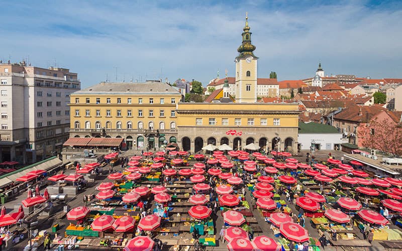 Dolac Market in Zagreb with red parasols and fresh produce stalls