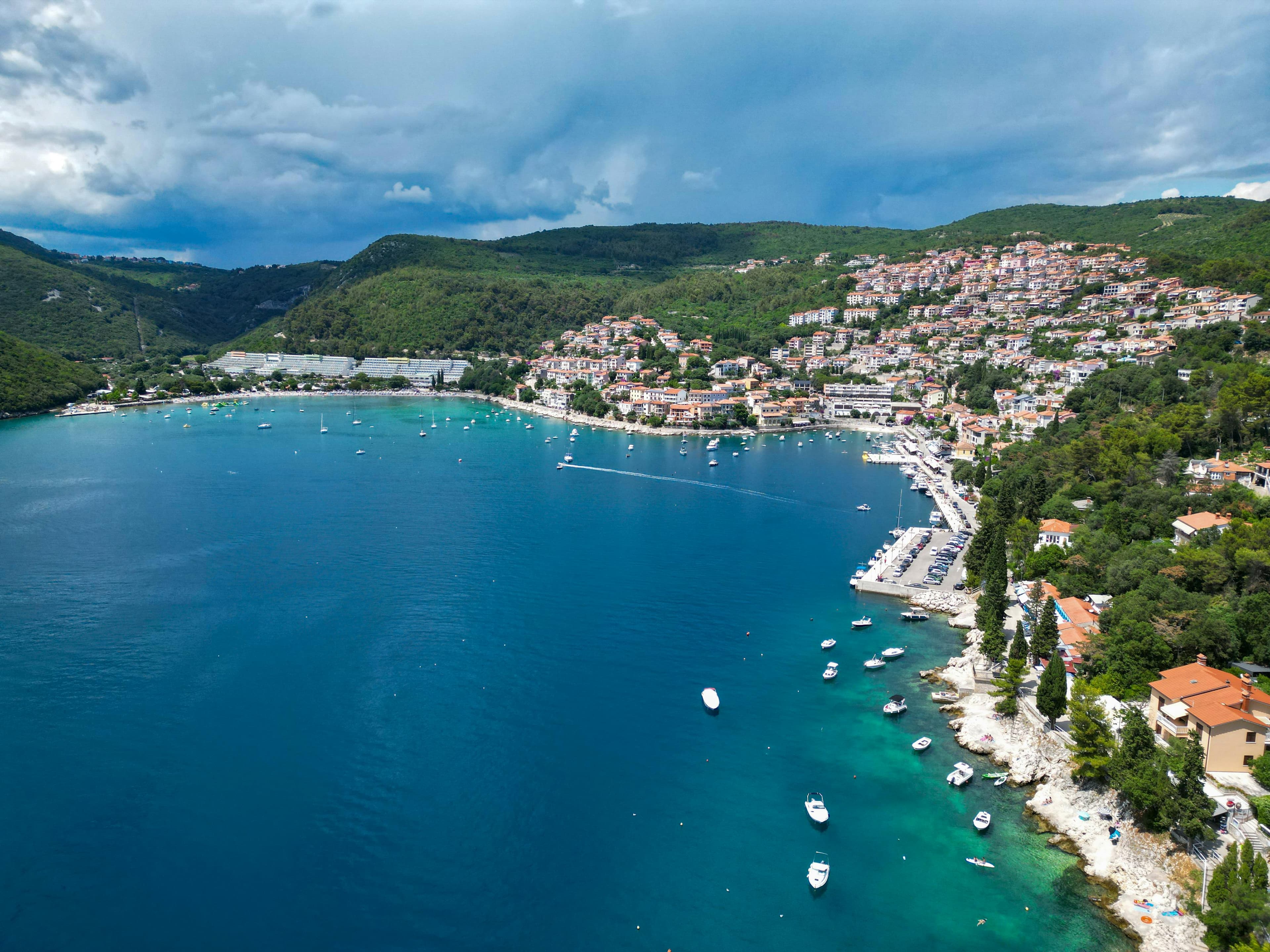 Rabac bay with pebble beaches and turquoise water below Labin, eastern Istria