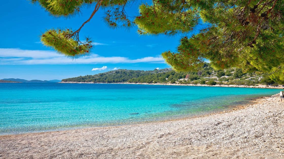 Murter beach — sandy and pebble shores on the bridge-connected Dalmatian island