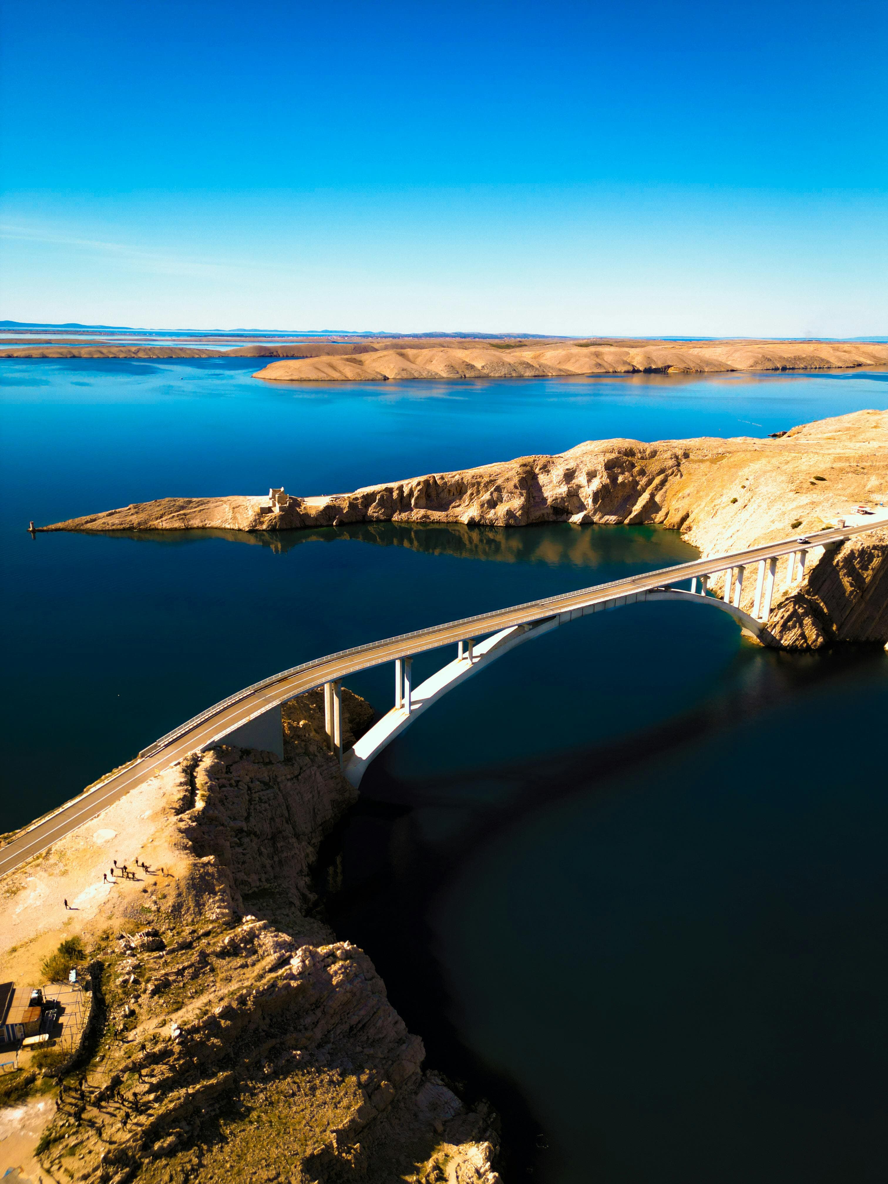 The bridge connecting the island of Pag to the Croatian mainland, surrounded by turquoise water