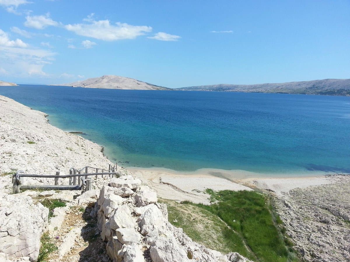 The start of the Life on Mars Trail near Metajna — white rocky path with the Adriatic below