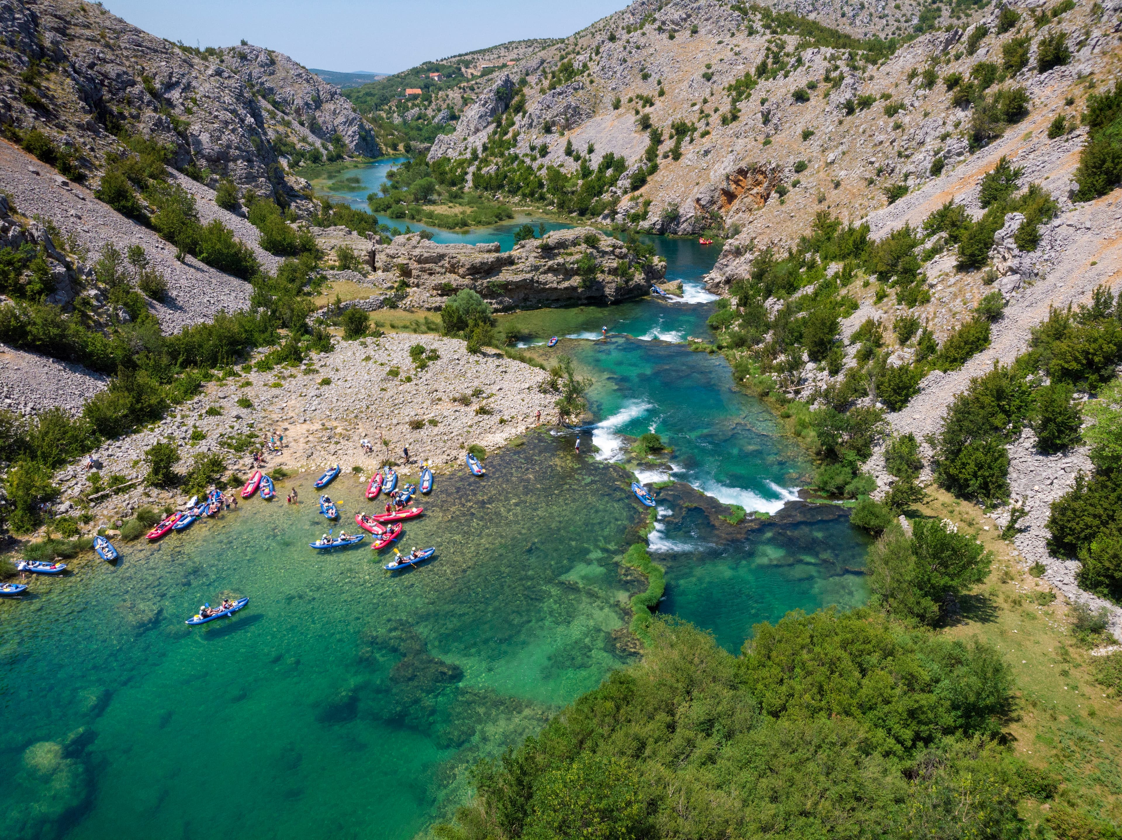 Rafting through the Zrmanja river canyon in Croatia — limestone gorges and clear water