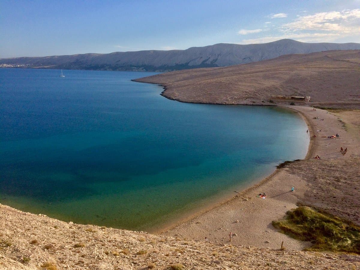 Ručica beach near Metajna on the island of Pag, Croatia — rocky cove with clear blue water