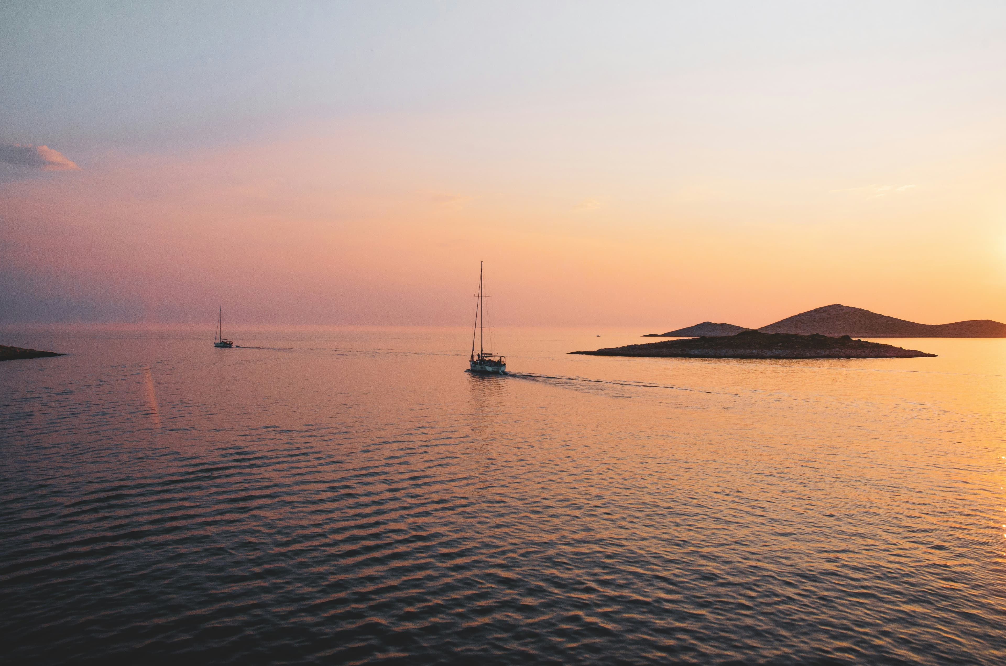 Sailing in Croatia — yacht on the turquoise Adriatic with Dalmatian islands in the background