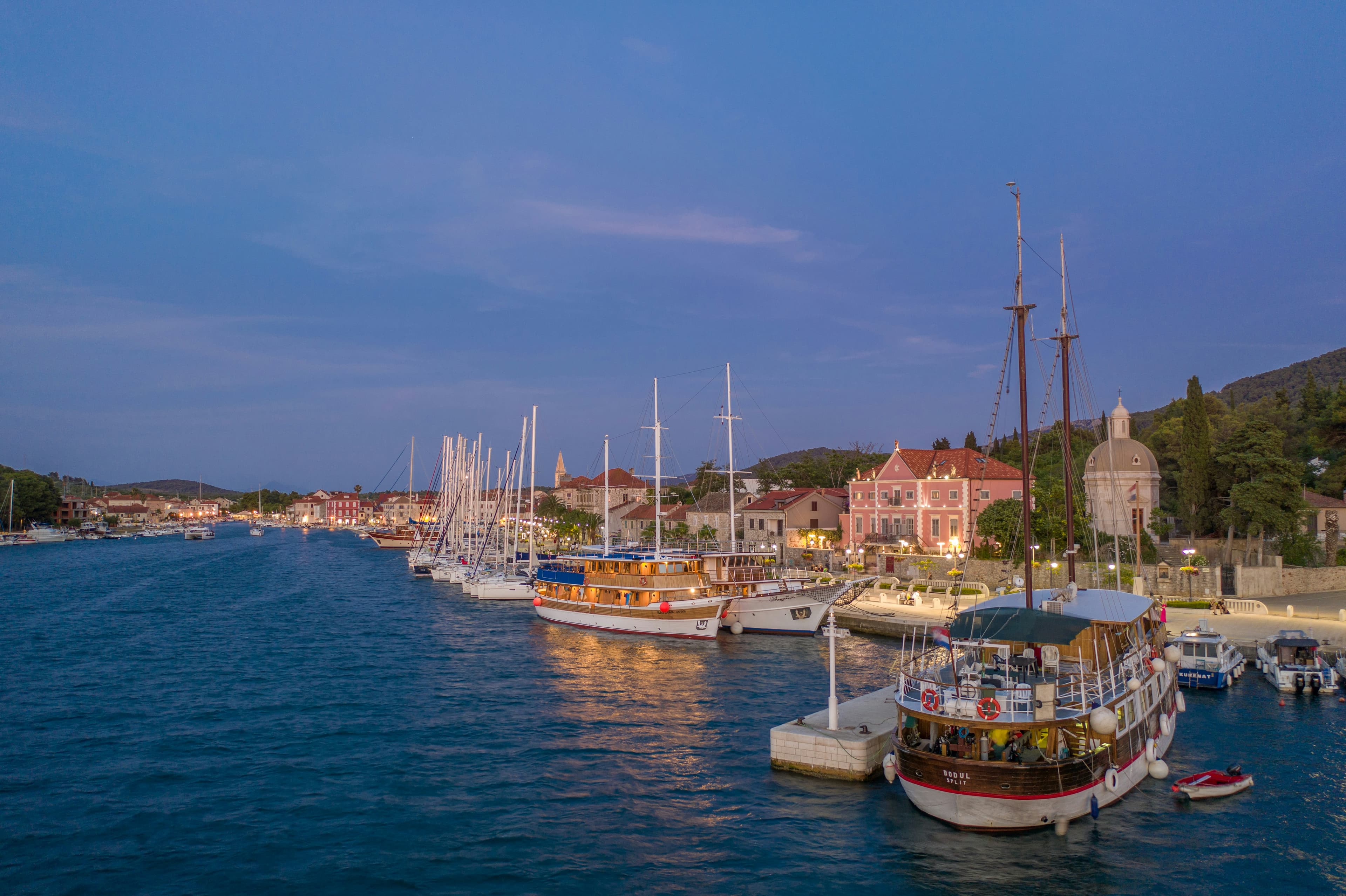 Sailing boats at sunset in Stari Grad harbour on the island of Hvar, Croatia