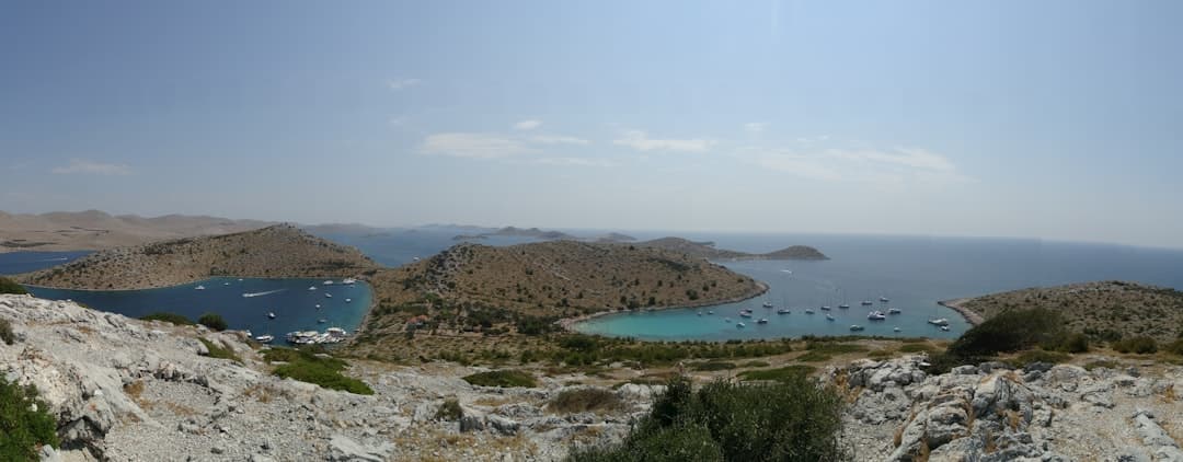 A panoramic view across the scattered Kornati and Telašćica archipelago, with bare limestone islets rising from a calm Adriatic.
