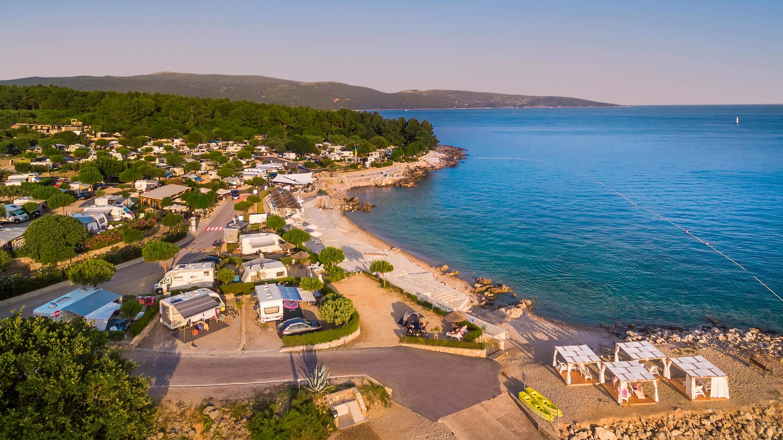 Family campsite on Krk island — beach camping on Croatia's bridge-connected island