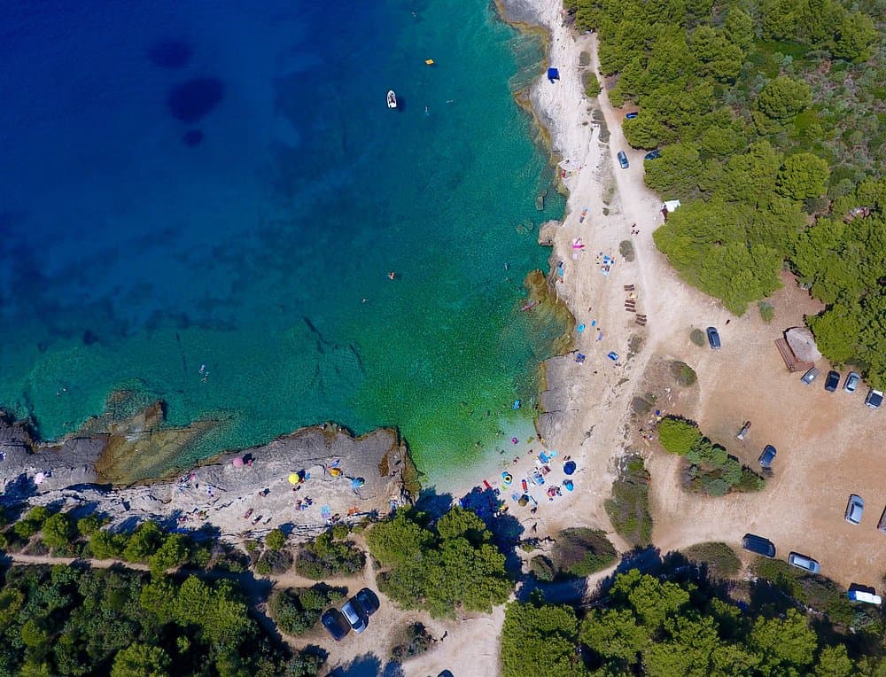 Swimming at Cape Kamenjak near Pula — wild rocky coves and clear Adriatic water