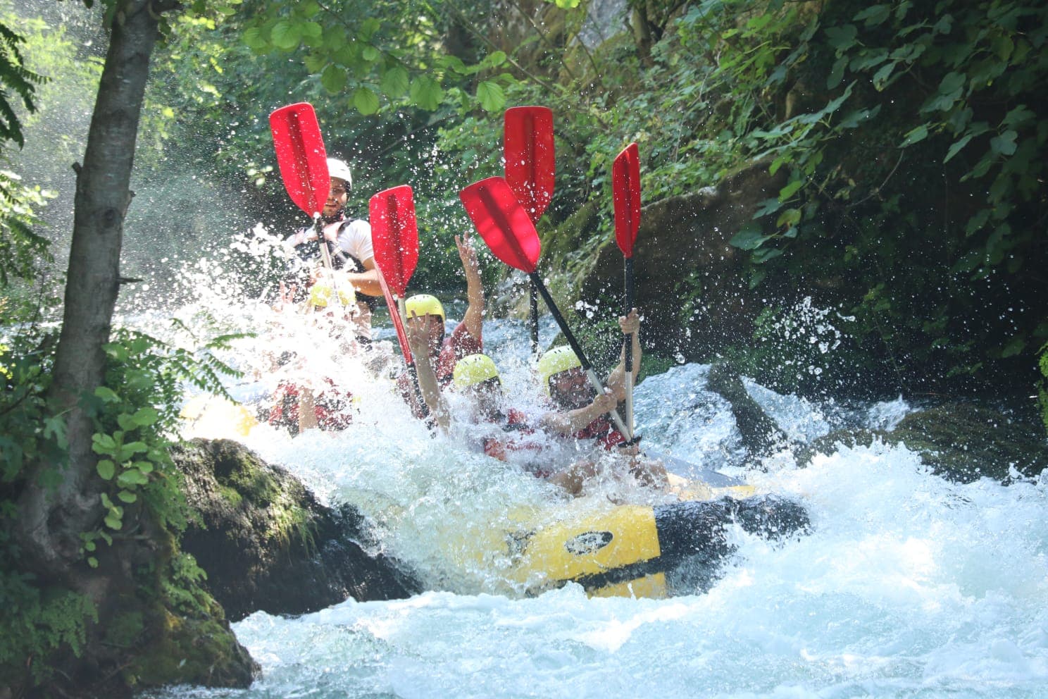Rafting on the Mrežnica river — emerald tufa water and forested canyon in central Croatia